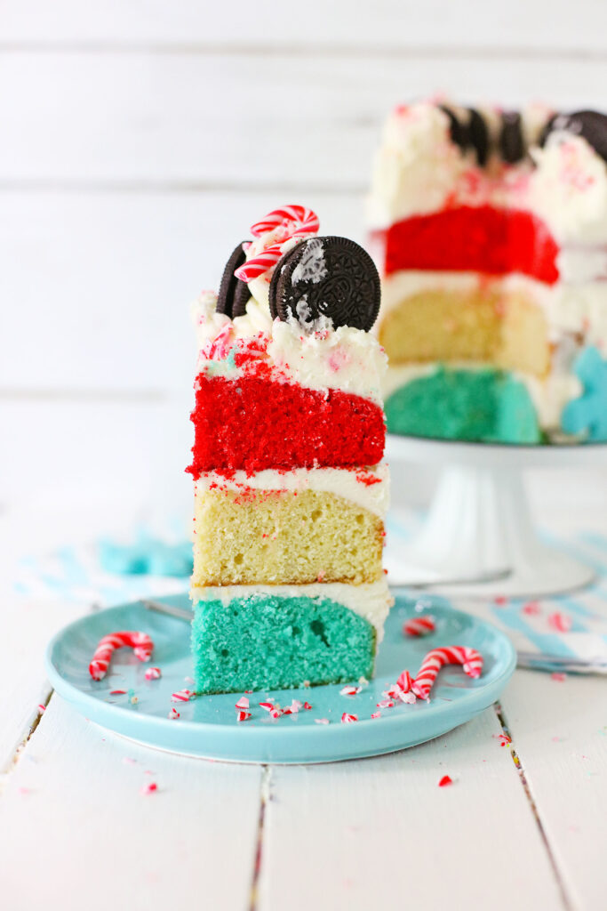 slide of layered peppermint cake on blue plate