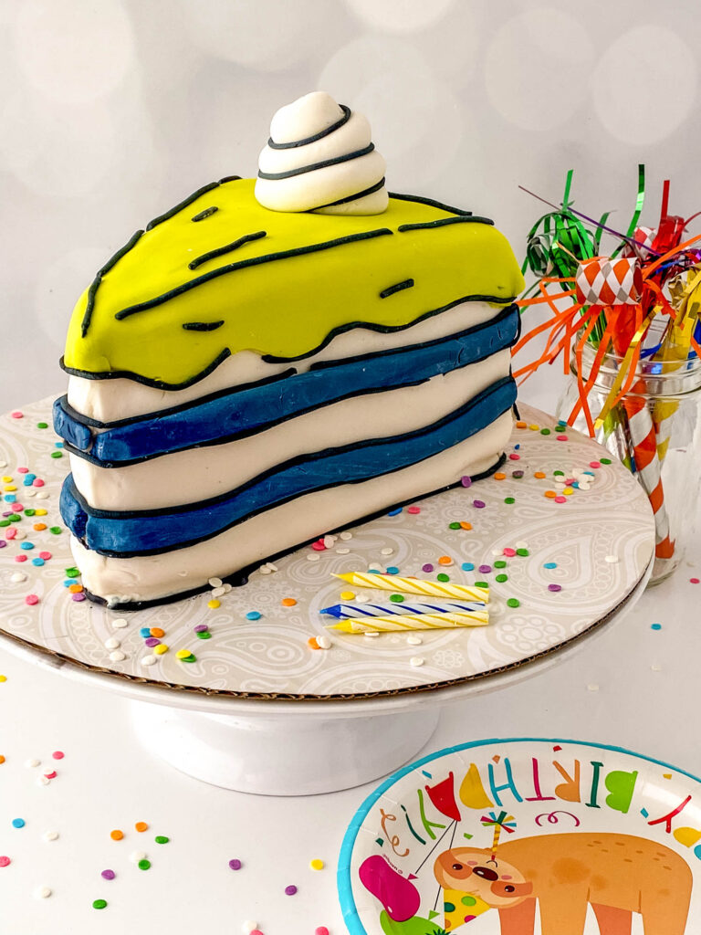cake stand with a slice of cartoon cake