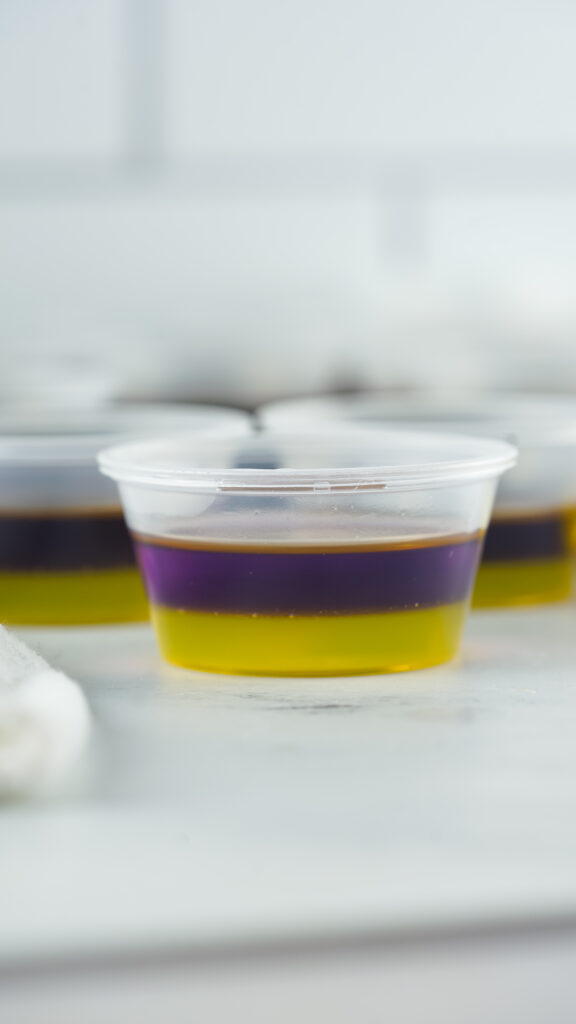 purple jello poured on top of yellow jello