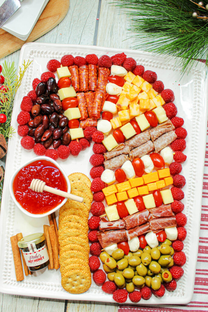candy cane charcuterie board on large serving tray