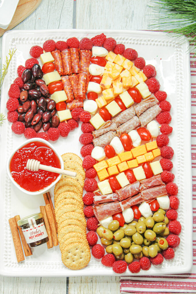 a candy cane charcuterie board on a holiday table