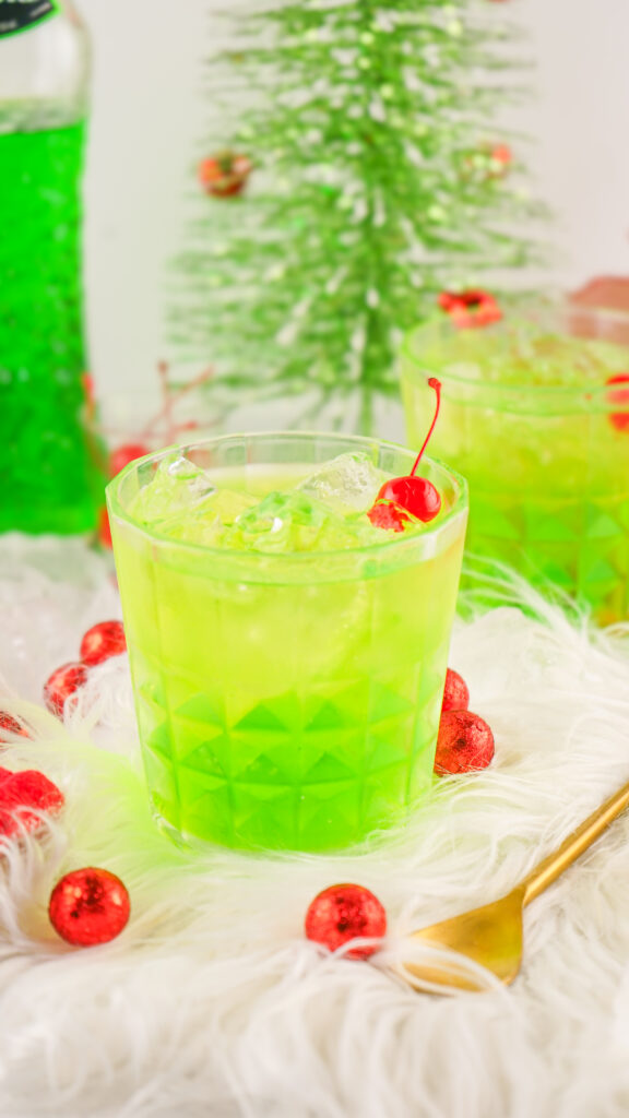 glass of grinch cocktail on christmas table