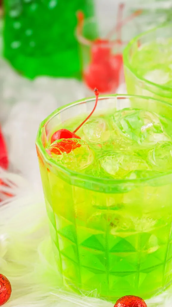 side view of a grinch cocktail in a glass