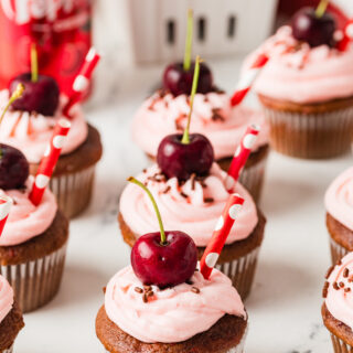 side view of dr. pepper cherry cupcakes on table