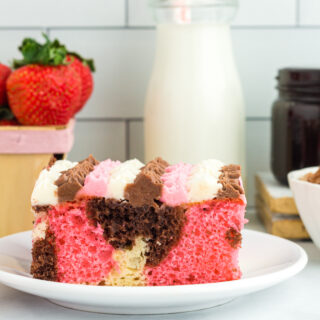side view of piece of Neapolitan Cake on plate