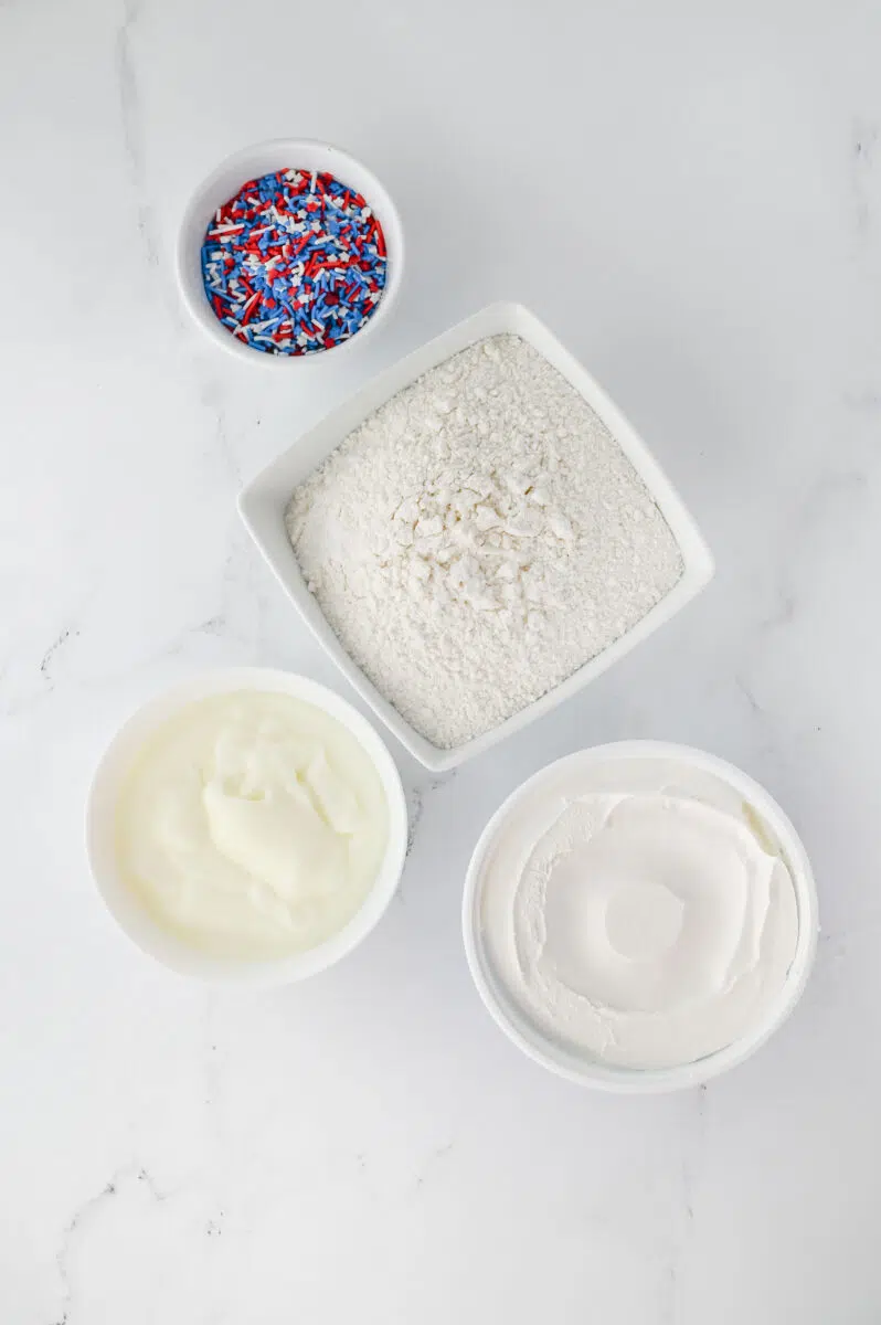 Ingredients needed to make Red White Blue Funfetti Dip laid out.